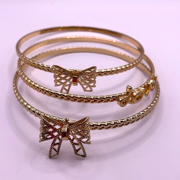Vintage Gold Tone Set of Three Bow Love Bangle Bracelets - Picture 2 of 2